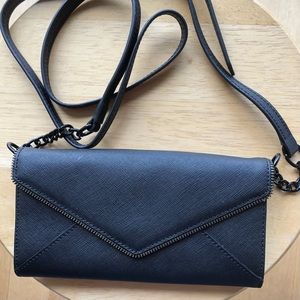 Rebecca Minkoff black crossbody wallet. Strap w/ chain detail. Interior pockets
